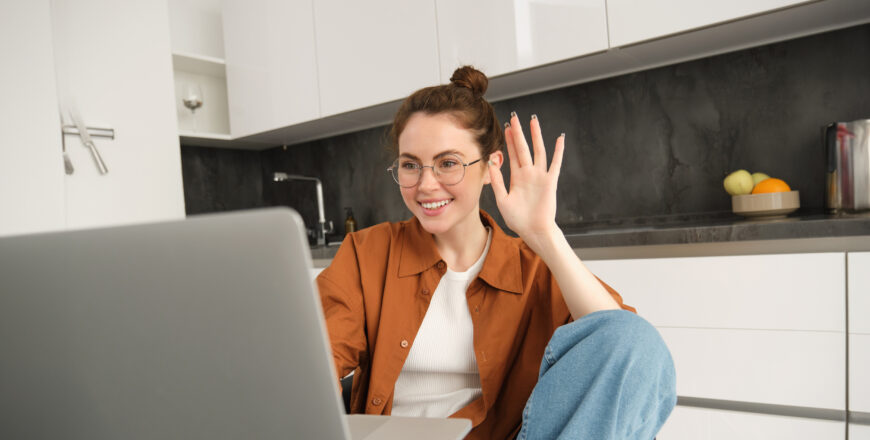 cheerful-young-woman-glasses-saying-hello-waving-hand-laptop-talking-friend-online-video.jpg